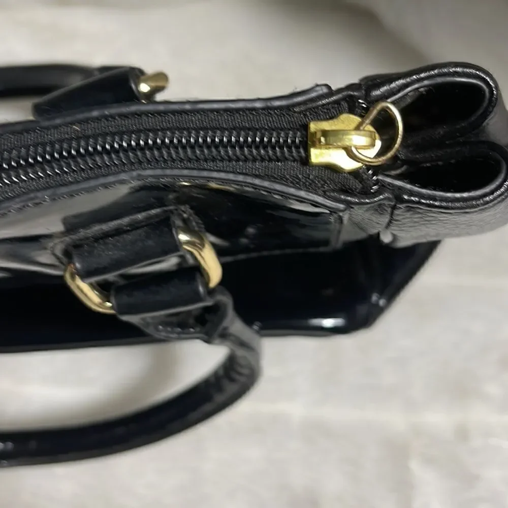 Tignanello black leather shoulder bag with gold tone hardwares